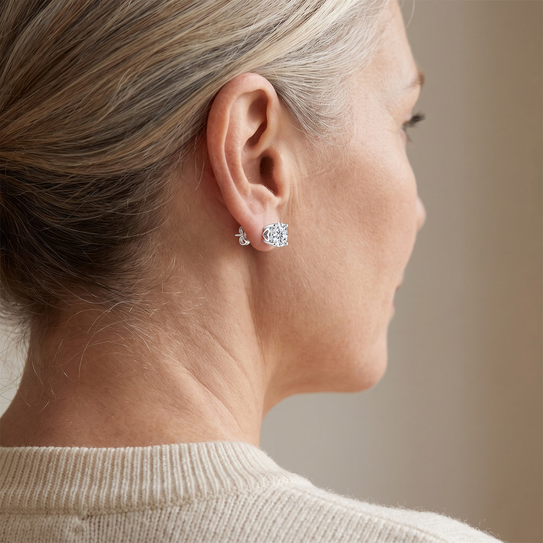 Ascona Heart-Prong Moissanite Studs — Silver, worn