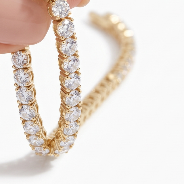 The line of stones on a gold tennis bracelet